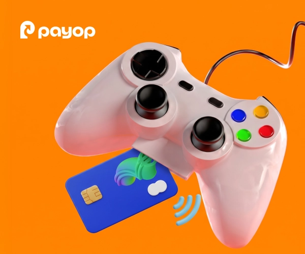 White gaming controller with a blue credit card on an orange background with Payop logo.