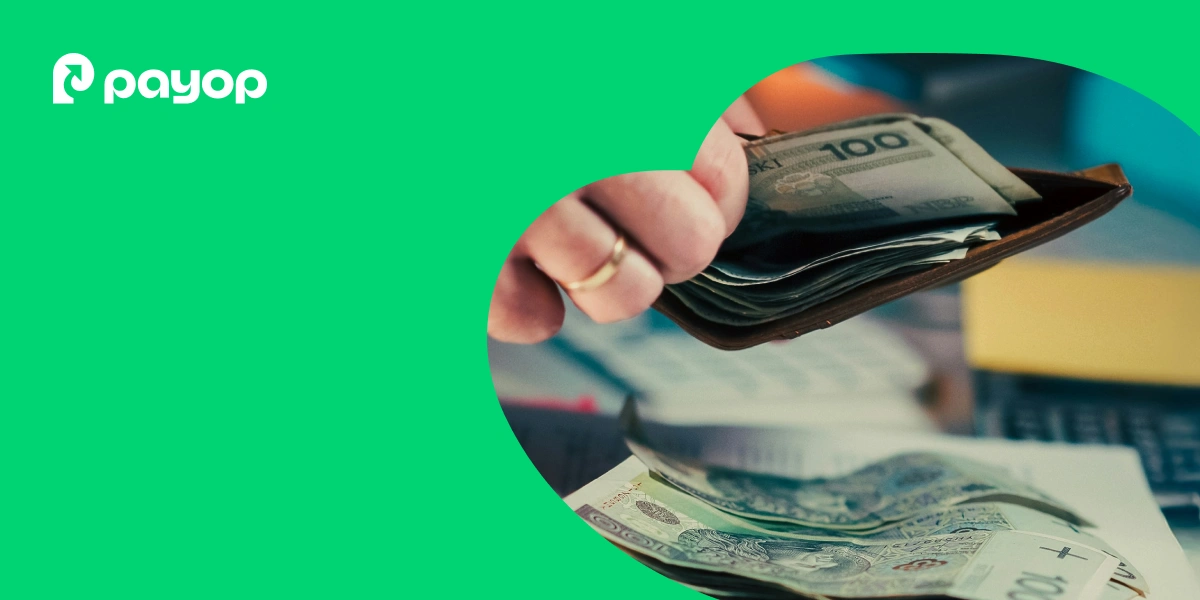 A hand holds an open wallet with various banknotes, suggesting financial transactions. The green background has a PayOp logo.
